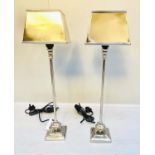 LIBRARY LAMPS, a pair, 59cm high, polished metal, with shades. (2)