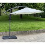 SUN UMBRELLA, circular cream canvas retractable wind up with frame and weights, 30cm W.