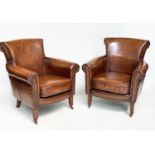 ARMCHAIRS, a pair, club style brass studded tan leather with scroll arms and back and tapering