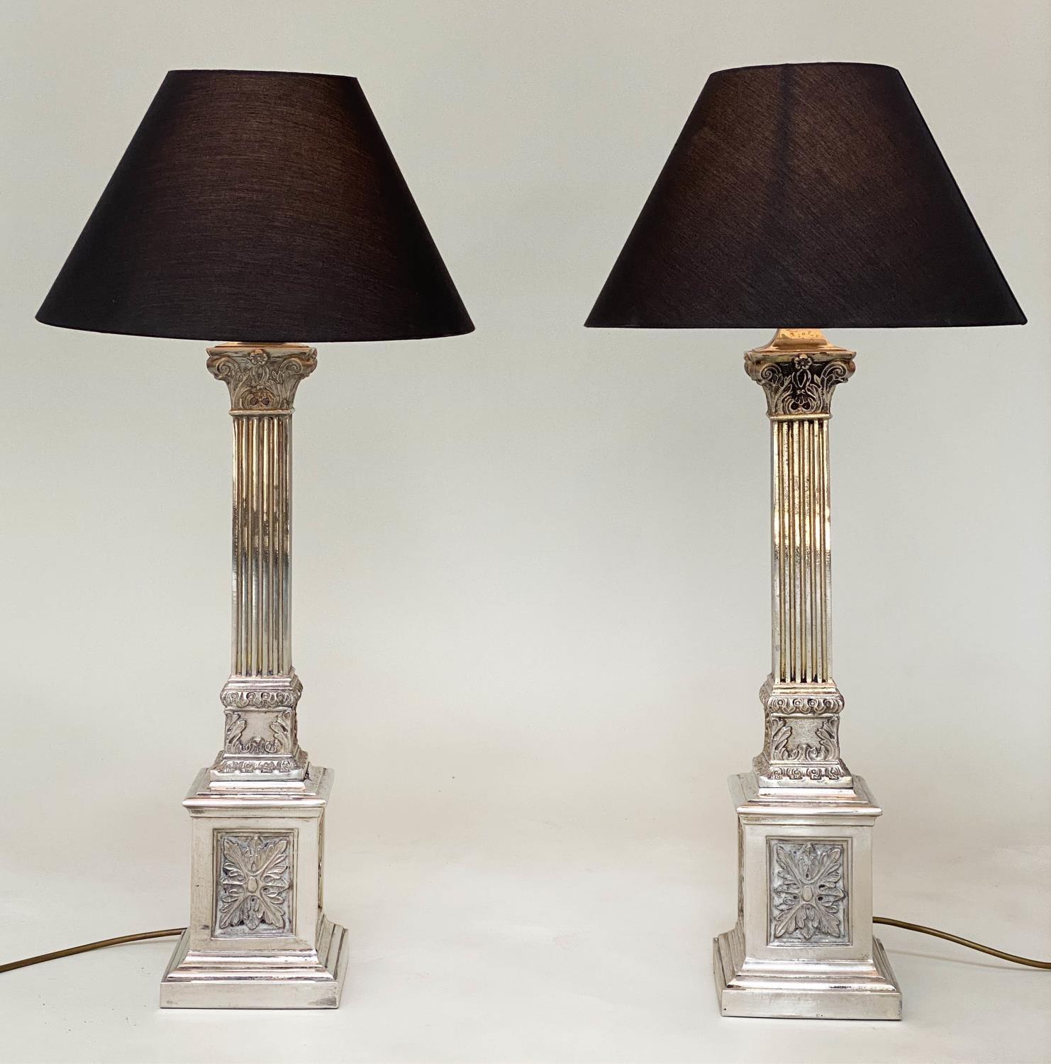 TABLE LAMPS, a pair, silvered metal with fluted square section columns and Corinthian capping,