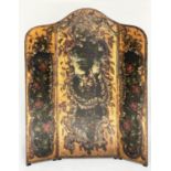 SCREEN, 19th century Continental painted leather and brass studded three fold garlanded panels of