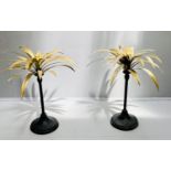 PALM TREE CANDLESTICKS, a pair, 46cm high, gilt palm leaves, black stands. (2)