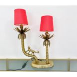 TABLE LAMP, two branch, gilt metal, in the form of a monkey climbing trees, with shades, 50cm x 32cm