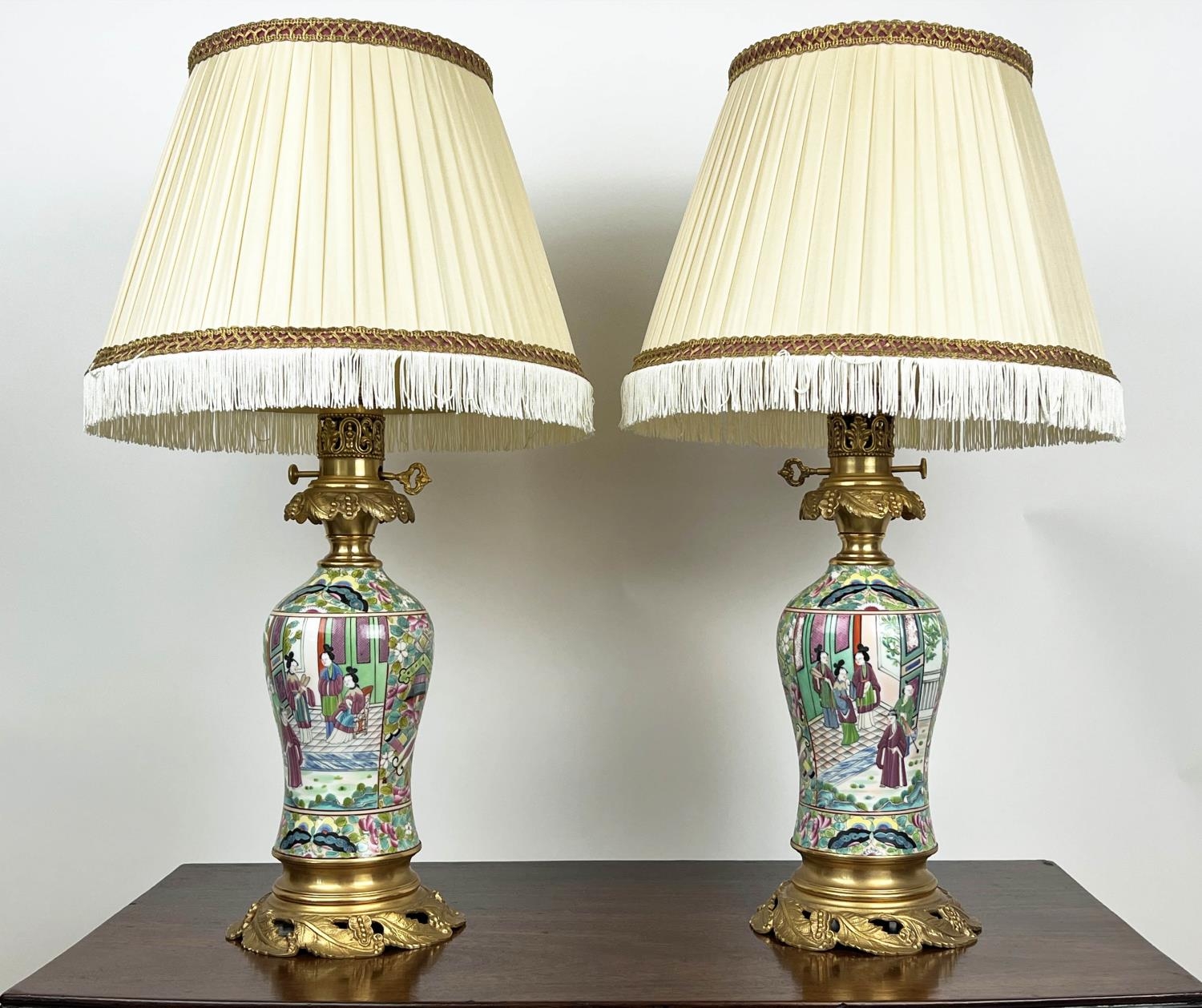 TABLE LAMPS, a pair, Cantonese hand-painted porcelain baluster form with fine ormolu mounts and silk