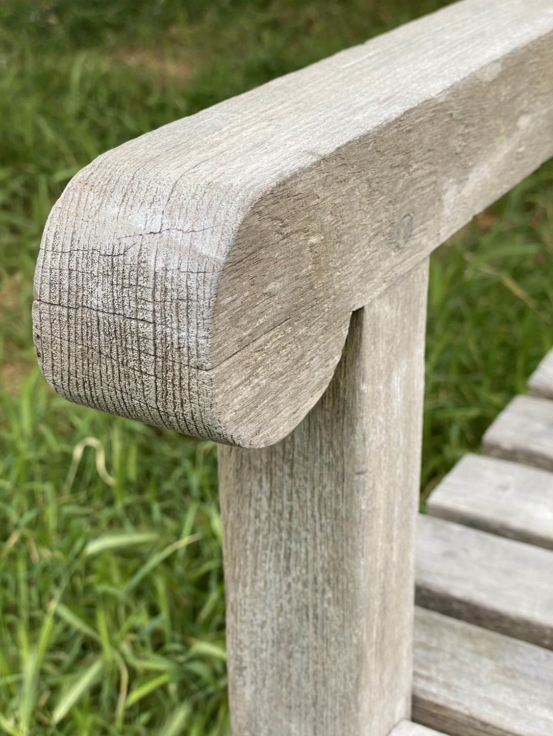 GARDEN BENCH, weathered teak with triangular slatted back and scroll arms, 137cm W. - Image 5 of 9