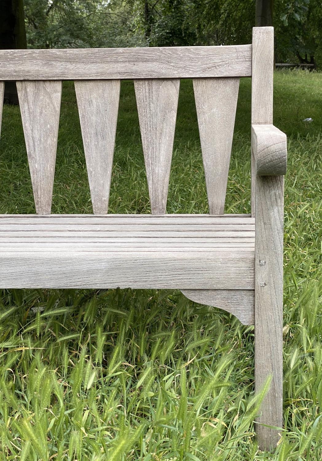 GARDEN BENCH, weathered teak with triangular slatted back and scroll arms, 137cm W. - Image 9 of 9