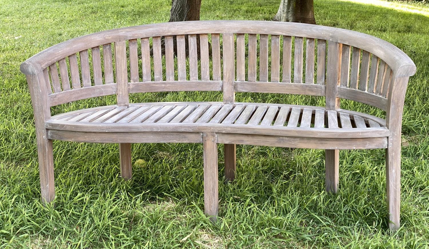 BANANA GARDEN BENCH, weathered teak with curved back and slatted construction, 150cm W.