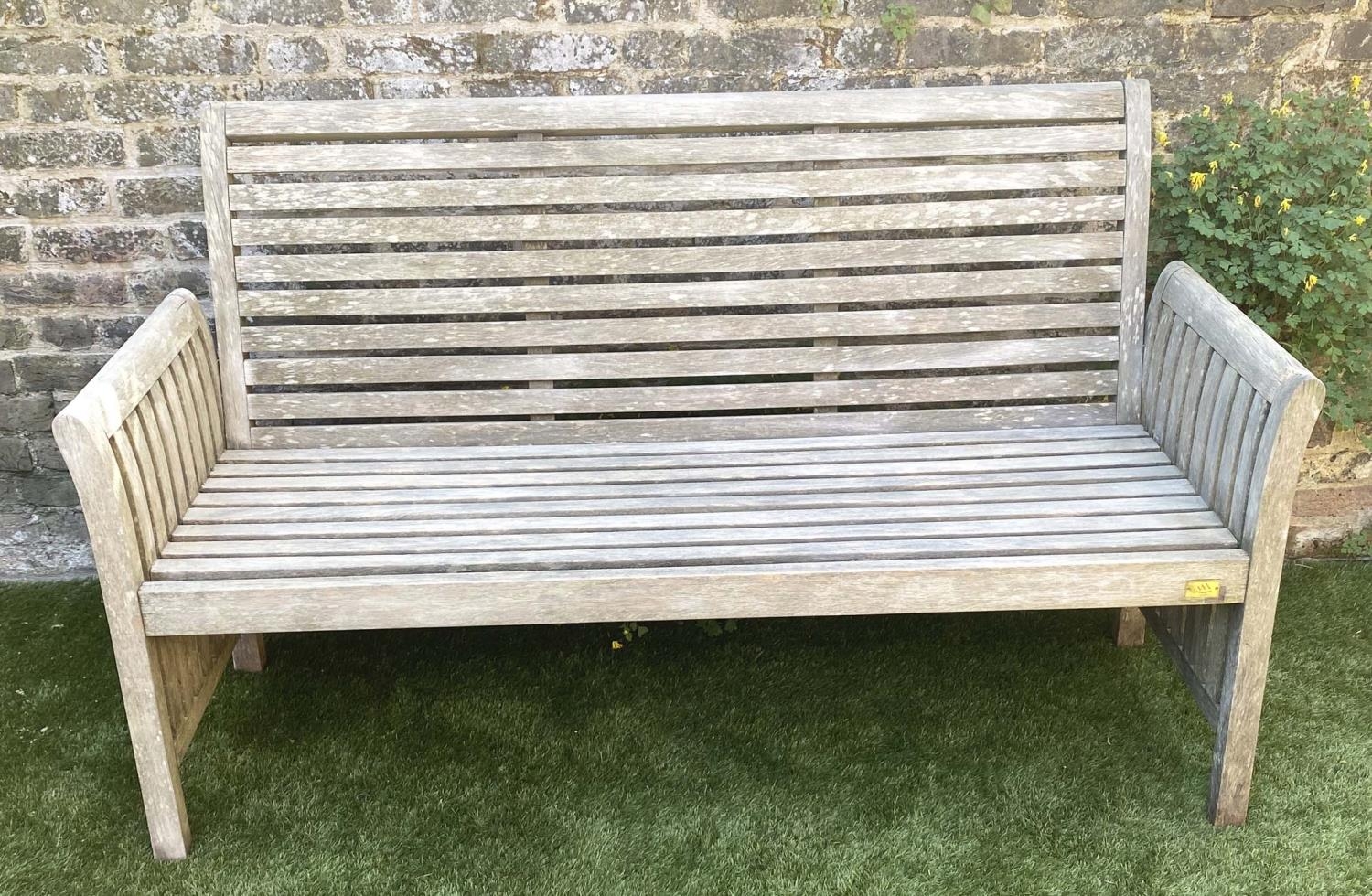 GARDEN BENCH, weathered teak with horizontal slat back and seat and downswept arms by 'Trinity',