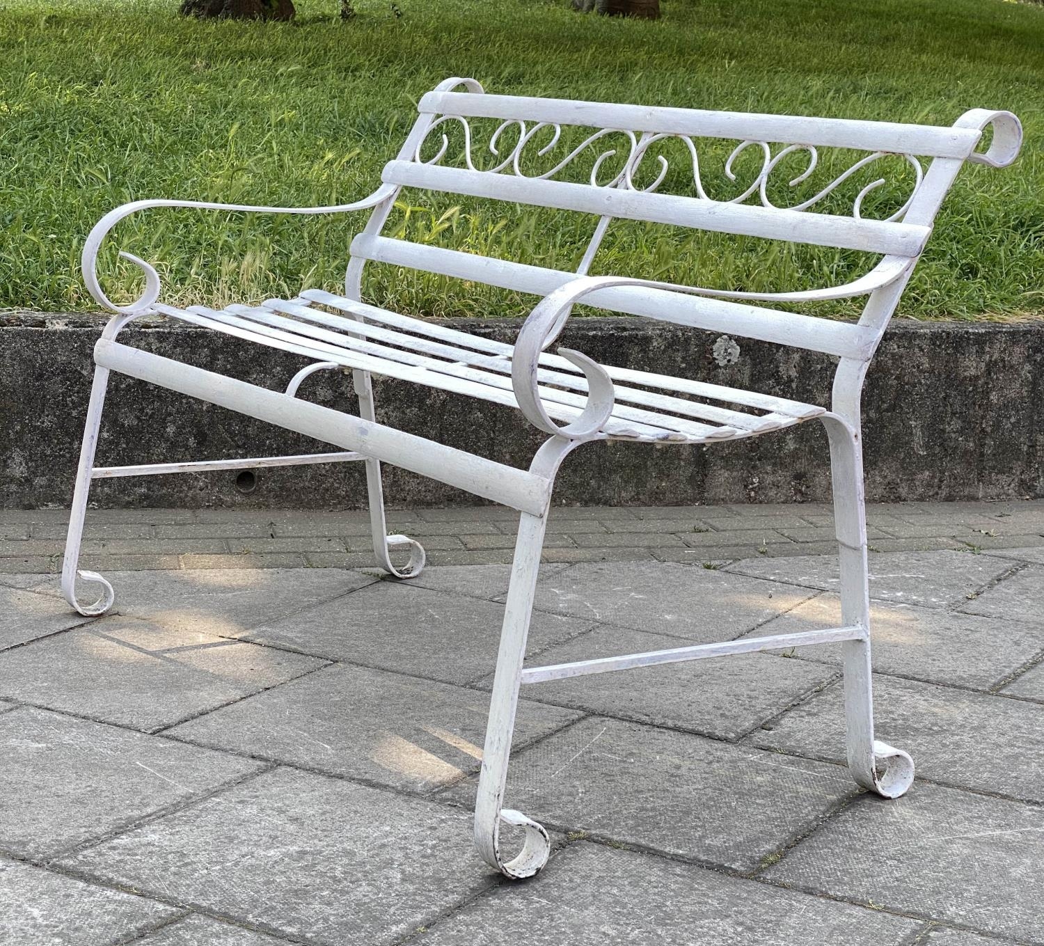 GARDEN BENCH, antique wrought iron and white painted with slatted back and seat and scroll arms, - Image 6 of 6