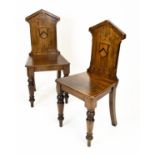 HALL CHAIRS, a pair, Victorian oak, ebonised and dog tooth inlaid with shield moulded backs. (2)