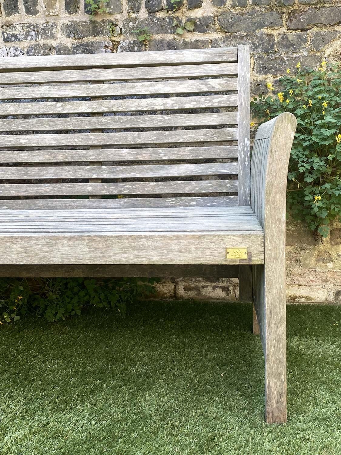 GARDEN BENCH, weathered teak with horizontal slat back and seat and downswept arms by 'Trinity', - Image 4 of 4