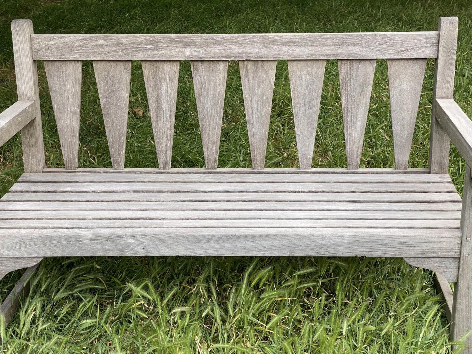 GARDEN BENCH, weathered teak with triangular slatted back and scroll arms, 137cm W. - Image 8 of 9