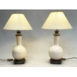 TABLE LAMPS, a pair, gourd vase form crackle glaze with gilt metal mounts and shades. 58cm H (2)