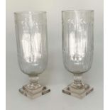 HURRICANE LANTERNS, a pair, cut glass cylindrical with engraved detail and stepped base, 40cm H. (2)