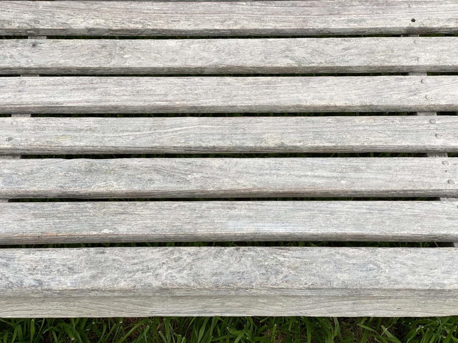 GARDEN BENCH, silvery weathered teak of slatted and pegged construction, 180cm W. - Image 4 of 4