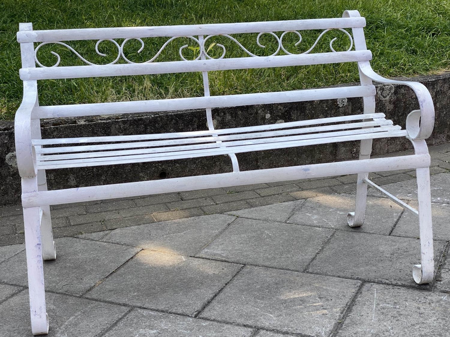 GARDEN BENCH, antique wrought iron and white painted with slatted back and seat and scroll arms, - Image 5 of 6