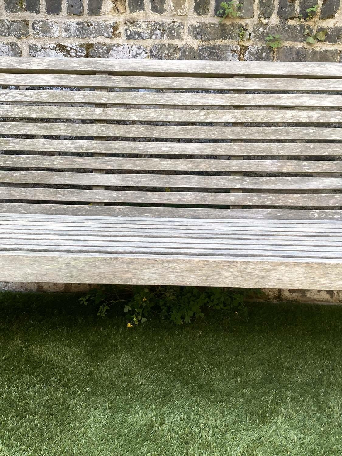 GARDEN BENCH, weathered teak with horizontal slat back and seat and downswept arms by 'Trinity', - Image 3 of 4