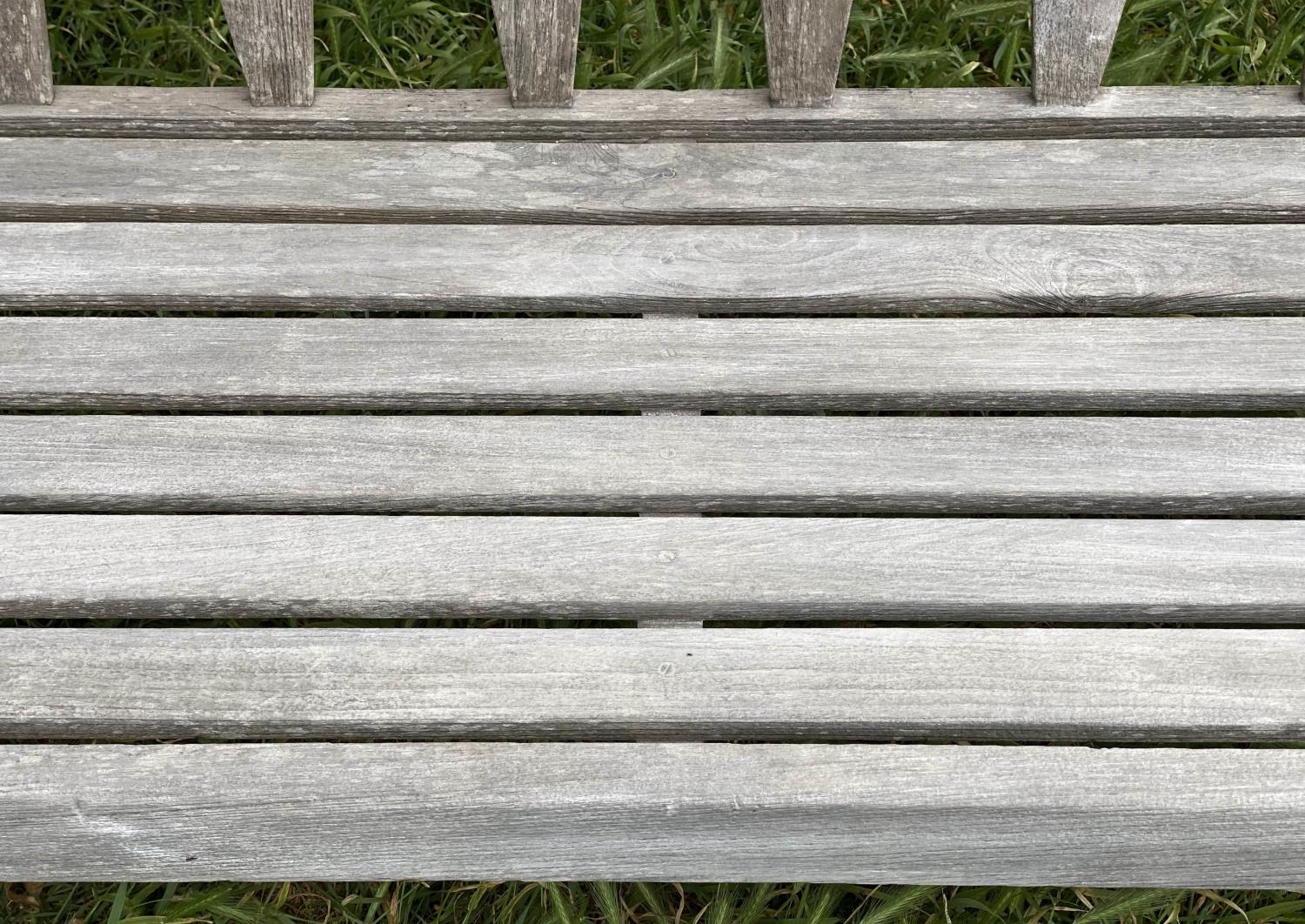 GARDEN BENCH, weathered teak with triangular slatted back and scroll arms, 137cm W. - Image 3 of 9