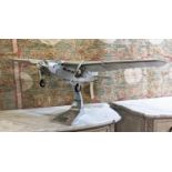 FORD TRIMOTOR MODEL PLANE, aluminium, 1926 design, hand built to approximate scale, raised on stand,