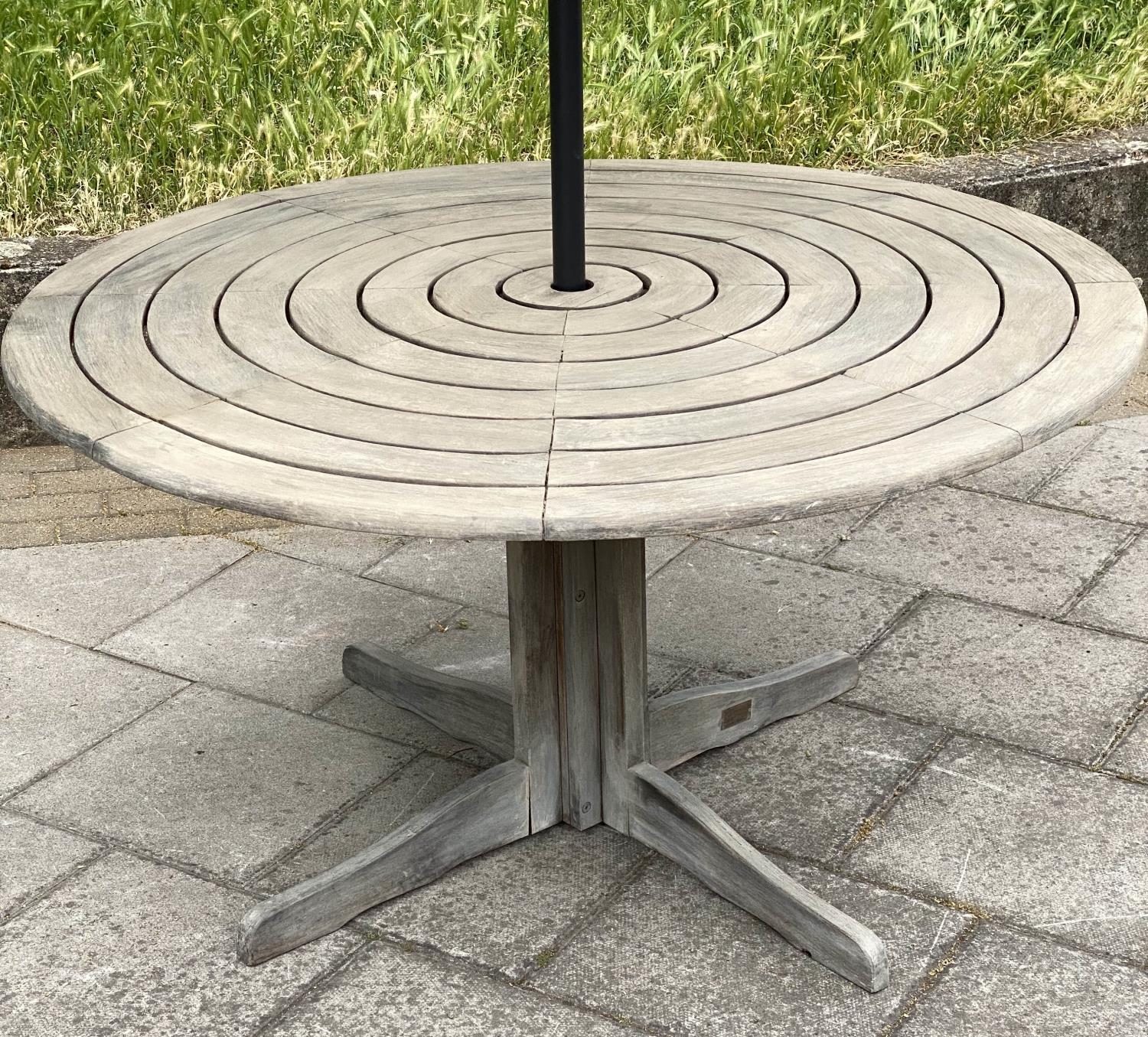 CIRCULAR GARDEN TABLE, weathered teak with circular concentric slatted top and centre column support - Image 8 of 8