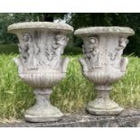 GARDEN URNS, a pair, well weathered reconstituted stone of campana form, 38cm W x 56cm H. (2)