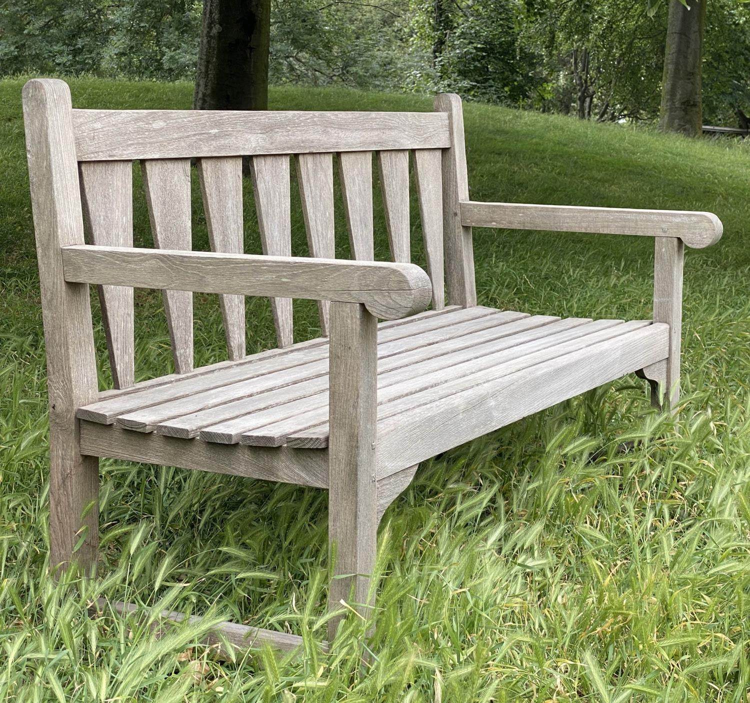 GARDEN BENCH, weathered teak with triangular slatted back and scroll arms, 137cm W. - Image 4 of 9