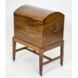 WINE COOLER, George III mahogany with hinged domed top, baize lining, brass handles and castors,