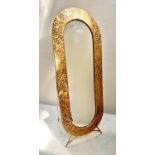 DRESSING MIRROR, 156cm high, 57cm wide, 48cm deep, free standing gilt metal foliate embossed