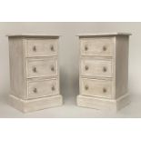 BEDSIDE CHESTS, a pair, grey painted each with three drawers and plinth base, 64cm H x 38cm x