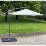 GARDEN SUN UMBRELLA, circular cream canvas retractable wind up with frame and weights (water