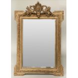 WALL MIRROR, late 19th/early 20th century French giltwood and gesso moulded with griffin and