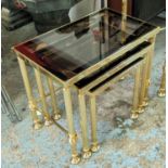 NEST OF TABLES, a set of three, 1960s French style, gilt metal and glass, 55.5cm x 33.5cm x 48cm. (