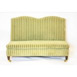 LOW BANQUETTE, striped green velvet on brass castors, 72cm H x 110cm.