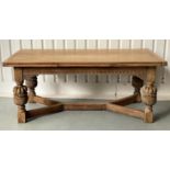 DRAWLEAF REFECTORY DINING TABLE, rectangular solid oak with planked, cleated top on heavily carved