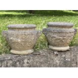 GARDEN URNS/PLANTERS, a pair, well weathered reconstituted stone, neo classical 'chariot' decoration
