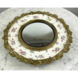 MIRROR, 50cm diam., convex brass bound CLARICE CLIFF plate, cream ceramic foliate sprig decorated