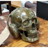 CONTEMPORARY SCHOOL SCULPTURAL STUDY, DJ skull, bronzed metal, 17cm H.