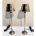 LIBRARY TABLE LAMPS, a pair, 64cm high, 20cm diameter, polished metal, with shades. (2)