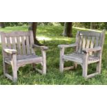GARDEN ARMCHAIRS, a pair, silvery weathered teak of substantial slatted and pegged construction by