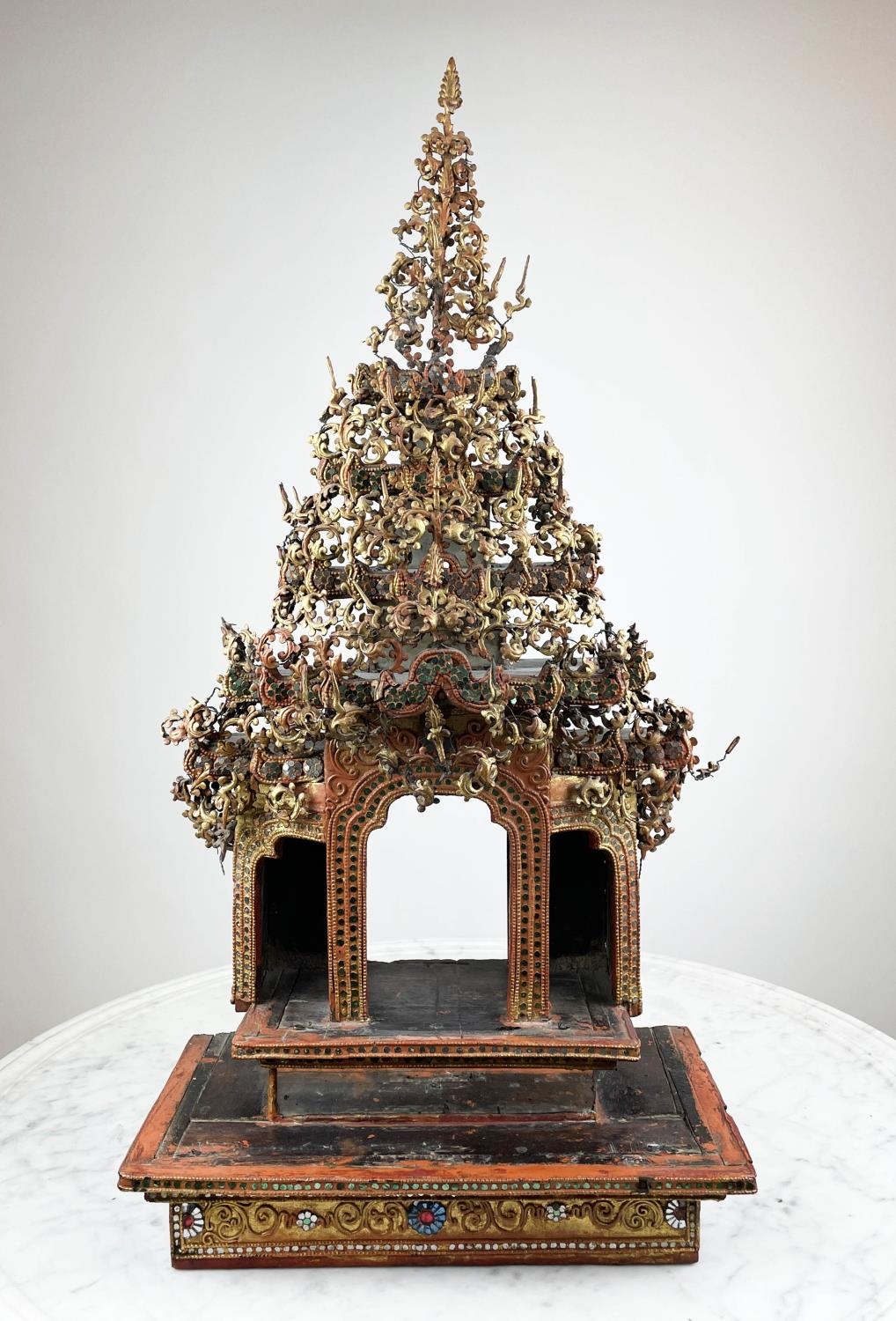 THAI BUDDHIST SHRINE, ornately carved wood with mirrored and gilt painted decoration, 77cm H x