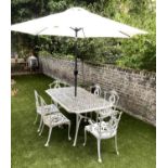 GARDEN TABLE AND CHAIRS, weathered cast aluminium with pierced table and six matching chairs, one