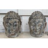 BUSTS OF BUDDAH, a pair, faux aged stone finish, 46cm H. (2)