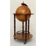 GLOBE DRINKS CABINET, in the form of an antique terrestrial globe on stand with rising lid, 90cm H.