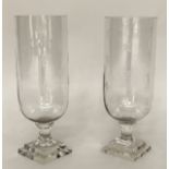 STORM LANTERNS, a pair, cut glass cylindrical with engraved detail and stepped base, 40cm H. (2)