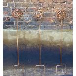 ARMILLARY SPHERE GARDEN STAKES, a set of three, 115cm H x 39cm W x 17cm D, coppered metal finish. (