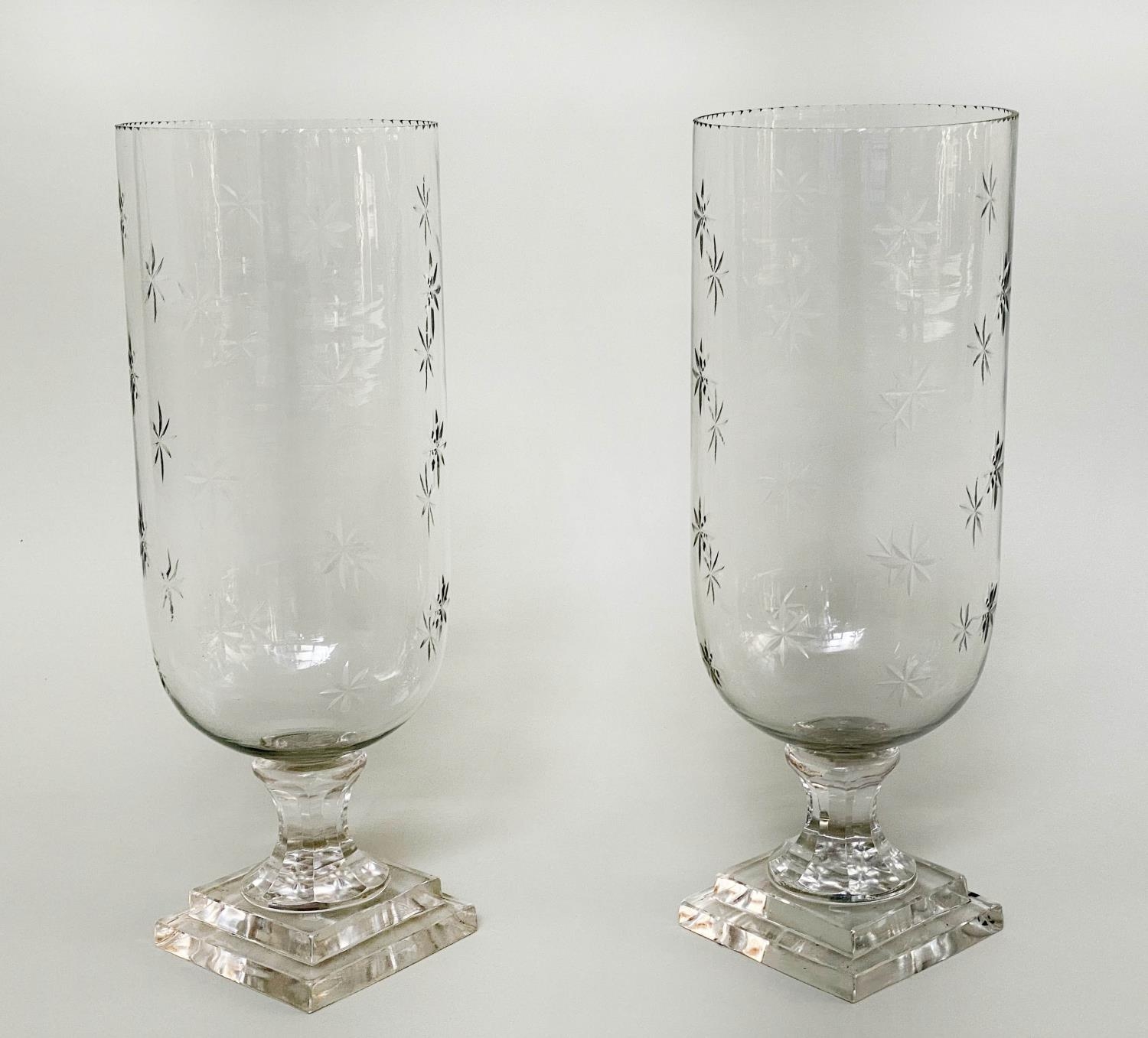 STORM LANTERNS, a pair, cut glass of vase form engraved with stepped plinth base, 40cm H. (2)