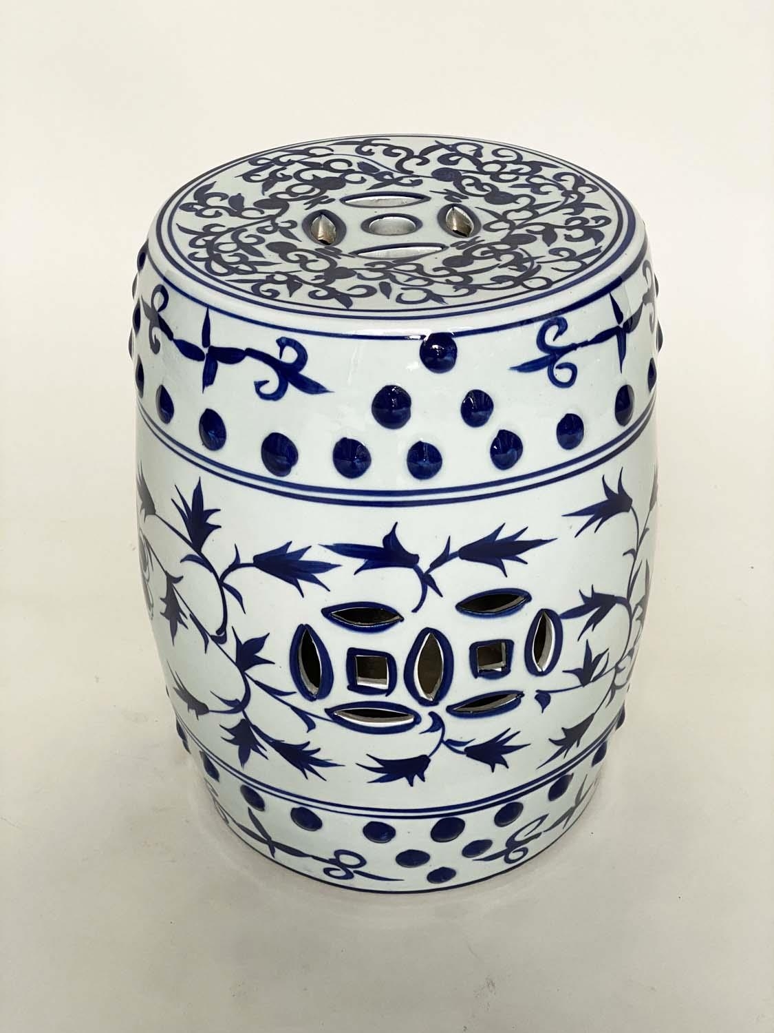 CHINESE STOOL, blue and white ceramic of barrel form with pierced top, 40cm H.