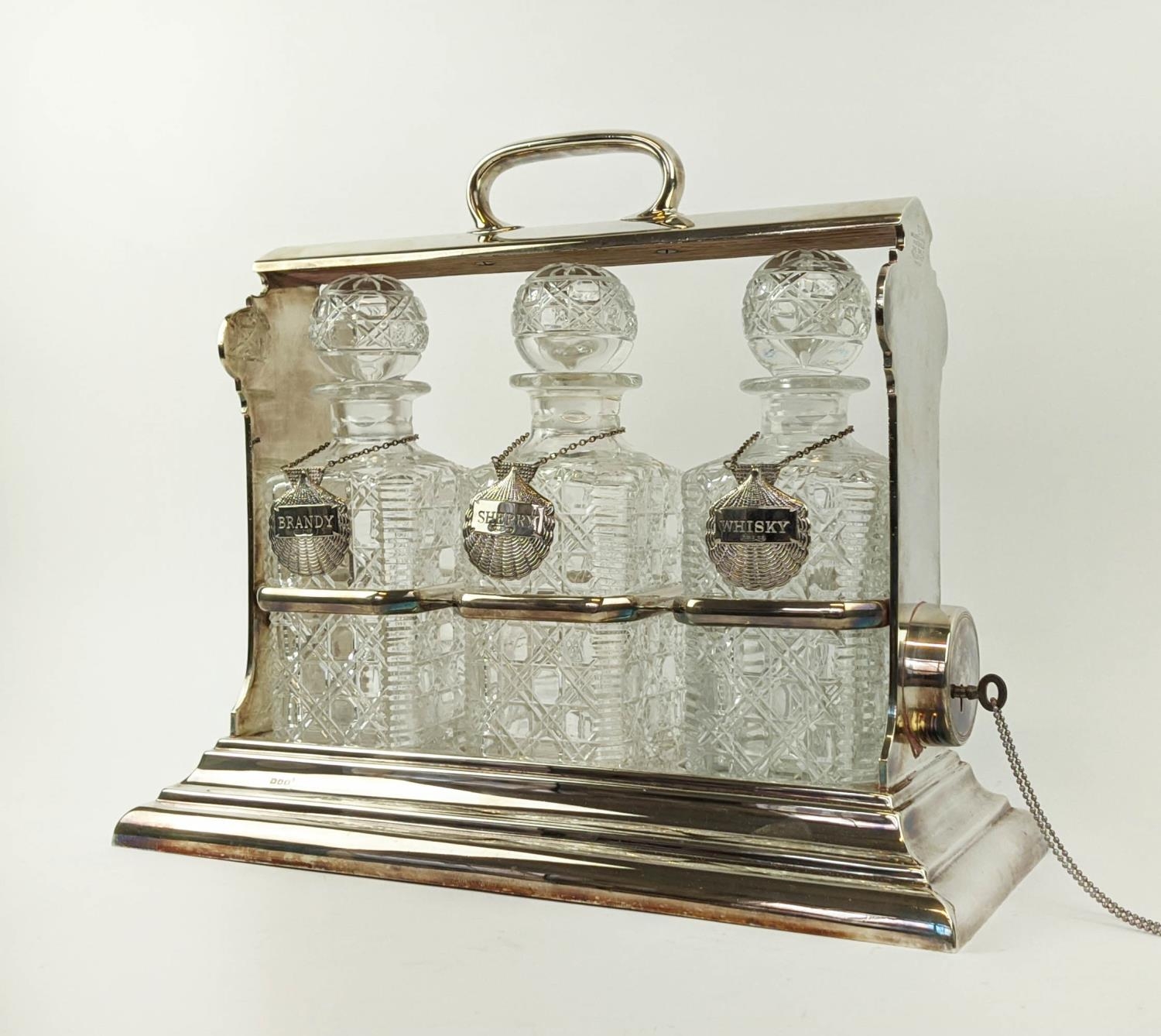 A WALKER AND HALL SILVER PLATED TANTALUS fitted with three square cut glass decanters, carrying - Image 2 of 11