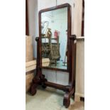 CHEVAL MIRROR, early Victorian mahogany, scrolled and reeded supports, 140cm H x 71cm W x 43cm D.
