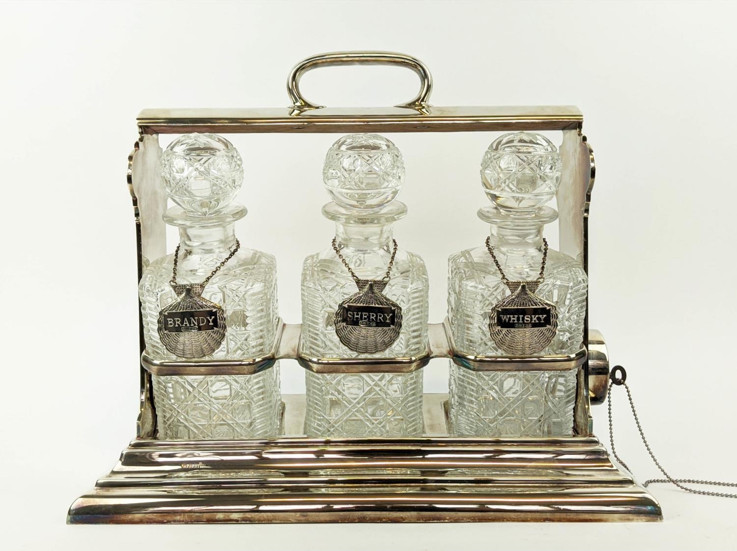 A WALKER AND HALL SILVER PLATED TANTALUS fitted with three square cut glass decanters, carrying - Image 7 of 11